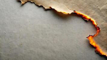 Burnt paper edge with fiery glow creating a unique backdrop effect photo