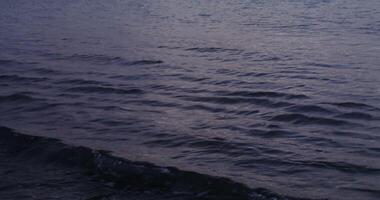 Sea or ocean wave with small waves. Crystal clear sea water, waves crashing against the shore, the coastline is not visible. in 4 k, red komodo. photo
