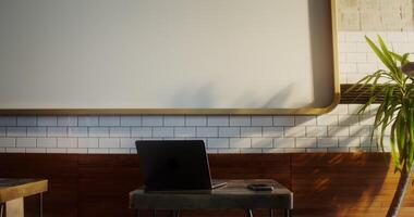 A man with a cup of coffee and a donut in his hands sits down at a table in a cafe opposite an open laptop - laptop photo