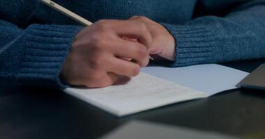 A woman is typing on a laptop sitting at her desk, working in the office, close-up of her hands, an unrecognizable person - sitting photo