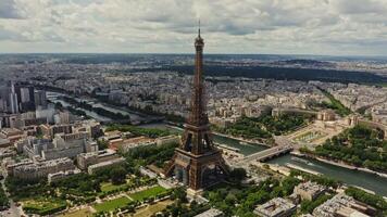 Drone horizontal panning view of the historic center of Paris with the Eiffel Tower and the Seine River in the foreground on a summer day. France Paris photo