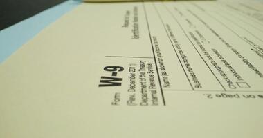 The form of the taxpayer's documents. The pen is on the paper. Close-up - Scene 2 photo