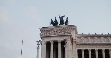 Facade of the Vittoriano monument with columns and sculptures in Rome at the Palazzo Venezia. Italy. in 4 k, red komodo. photo