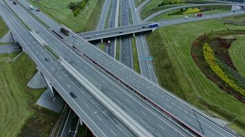 Multilevel road, top view, filming from a quadrocopter. View of the road junction with cars passing along it, shooting from a drone photo