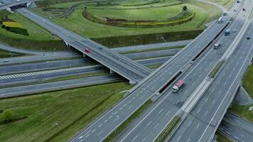 Multilevel road, top view, filming from a quadrocopter. View of the road junction with cars passing along it, shooting from a drone - junction photo