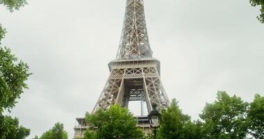 Bottom view of the Eiffel Tower on a sunny summer day. Spire reconstruction. France Paris. 4k , red komodo - summer photo