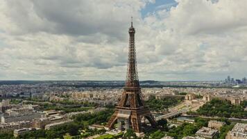 Drone horizontal panning view of the historic center of Paris with the Eiffel Tower and the Seine River in the foreground on a summer day. France Paris - center photo