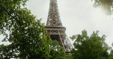 Bottom view of the Eiffel Tower on a sunny summer day. Spire reconstruction. France Paris. 4k , red komodo photo