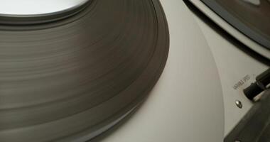Sound recording on a tape recorder in a recording studio. Fast movement of the magnetic tape, close-up - magnetic - on photo