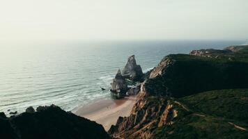 The sea at the foot of the mountains, a bird's-eye view from the mountains to the sea distance photo