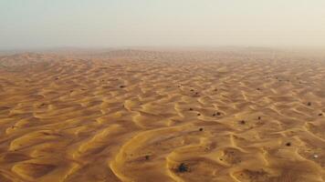 Drone view of sand dunes with sand merging with the sky. Driving off-road in a lifeless desert - desert photo