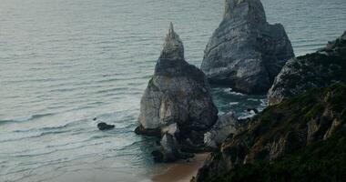 Top view of the coastline. Rocks sticking out of the water, shallow reef - shallow photo