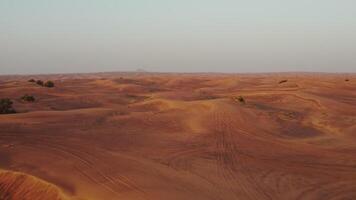 A bright red desert. Sand dunes from a bird's-eye view. Contrasting view of the sand with the sky photo