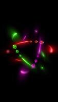 A virtual 3D illustration of a multi-colored atom showing spinning protons and neutrons. video