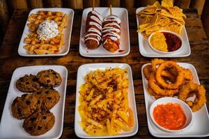 waffles, corn dog, nachos, cookies, loaded fries, onion rings photo