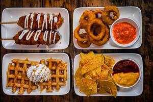 corn dog, onion rings, waffle and nachos photo
