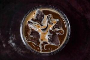 an iced coffee with ice and caramel photo