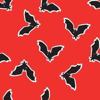 pattern with bats on a red background vector