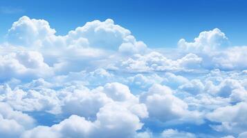 A beautiful bright blue summer sky with fluffy white cumulus clouds photo