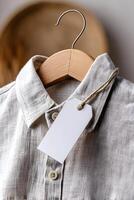 Blank hang tag on linen shirt for lifestyle branding concept photo