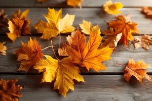 Vibrant maple leaves scattered on a rustic wooden surface photo