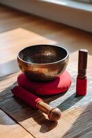 Meditation Tools Sound Bowl and Bell on Cushion photo
