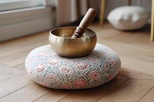 Tibetan Singing Bowl on Meditation Cushion photo