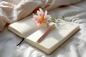 Gratitude journal with soft morning light and a delicate flower sprig photo