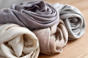 Soft fabric folds in neutral tones with a flowing texture photo