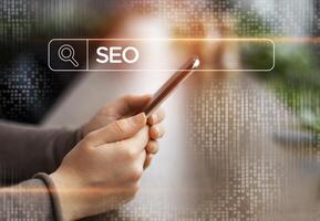 Unrecognizable Businesswoman Browsing Internet On Smartphone Searching SEO Specialist Sitting In Modern Office. IT Business Development And Seo-Optimization. Collage With Searching Box, Cropped photo