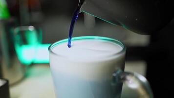 Pouring syrup when making a coffee cocktail video