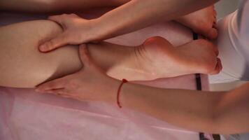 Professional massage of the calf muscle close-up view from above video