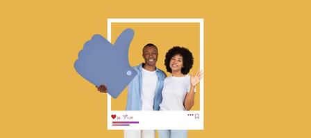 Two influencers are smiling and posing with a large thumbs up symbol. The background is bright yellow, showcasing their lively personalities while promoting online content creation. photo