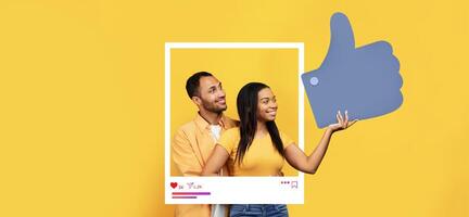 Two individuals express joy and connection, standing together against a vibrant yellow backdrop. They display enthusiasm and engagement, symbolizing social media interactions. photo