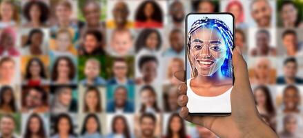 A person holds a smartphone displaying a facial recognition scan of their face. Behind them is a collage of diverse individuals, showcasing advancements in identification technology. photo