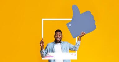 A joyful individual expresses excitement by giving a thumbs up. They are positioned inside a social media-style frame against a vibrant yellow background, embodying positivity and engagement. photo