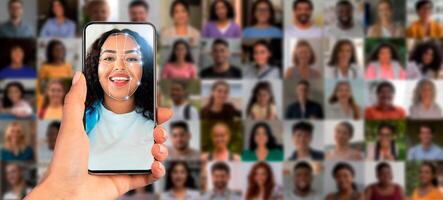 A person holds a smartphone in hand, using face recognition technology to identify different individuals displayed on the screen, highlighting the modern advancements in identification technology. photo