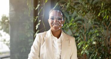 A professional individual stands indoors, showcasing the integration of facial recognition technology. This new method of identification represents a shift towards a more secure future. photo