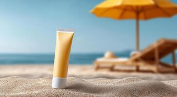 A tube of sunscreen stands prominently on the sandy beach, surrounded by sun loungers and a bright yellow umbrella. The ocean waves lap gently in the background on a sunny day. photo