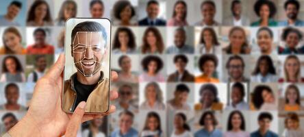 A smartphone held in a hand displays a facial recognition scan of a man, surrounded by a collage of various individual portraits, highlighting modern identification technology. photo