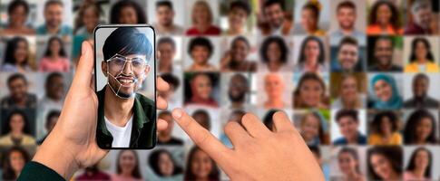 A person is using a smartphone to scan their face for identification purposes. In the background, a collage of diverse faces highlights the technology's capability. photo