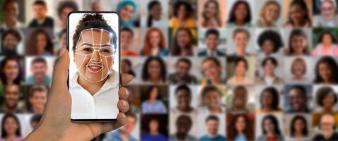 A user scans their face with a smartphone to utilize modern identification technology. In the background, a collage of diverse faces showcases the range of people being recognized. photo