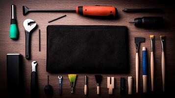 A neatly arranged set of various hand tools and brushes on a wooden surface, showcasing craftsmanship photo