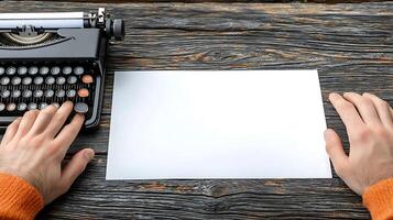A person preparing to type on a vintage typewriter with a blank sheet on a rustic wooden table photo