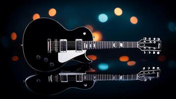 A sleek black electric guitar positioned on a reflective surface with colorful bokeh lights in the background photo