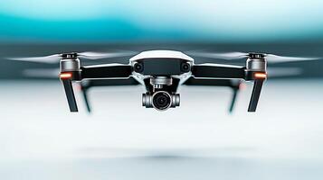 A sleek drone hovering in mid-air, showcasing advanced technology against a blurred background photo