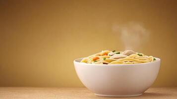 A steaming bowl of pasta with vegetables and chicken on a textured golden background photo