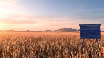 A vibrant blue beehive stands in a golden wheat field under a serene sunset sky photo