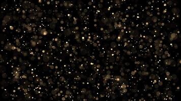 Abstract animation concept of golden shimmering glitter particles for birthday and holiday celebrations. 4k loop bokeh background with light particles on dark background. Animation footage video