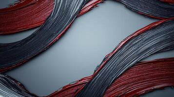 Abstract art featuring flowing red, black, and gray paint strokes on a smooth background photo